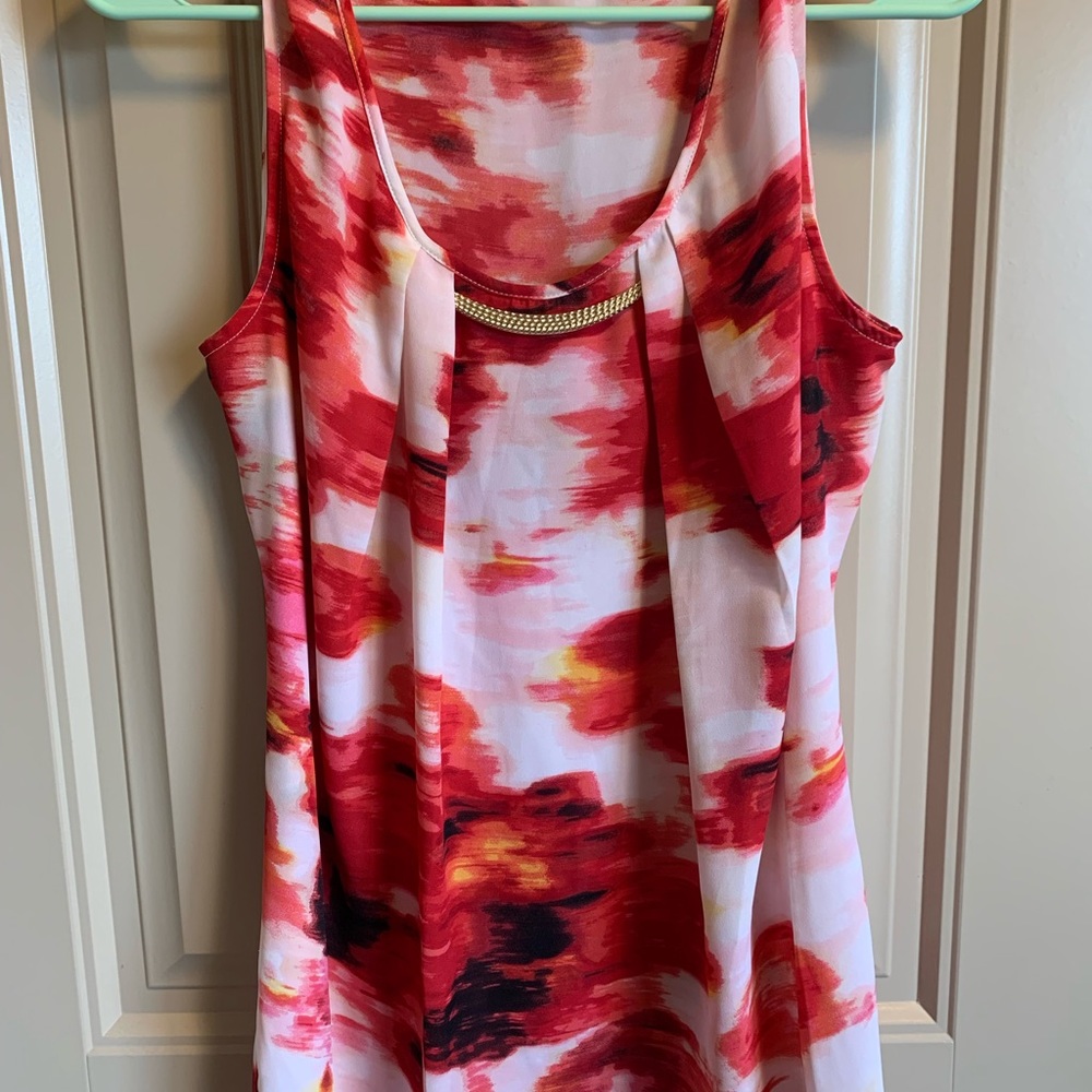 Multi colored woman’s top Size L gold bar accent